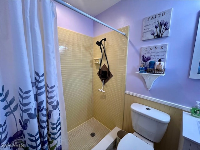 bathroom featuring toilet and a shower with curtain