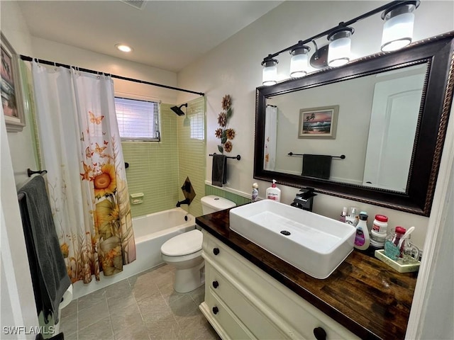 full bathroom with shower / bath combination with curtain, vanity, toilet, and tile patterned flooring