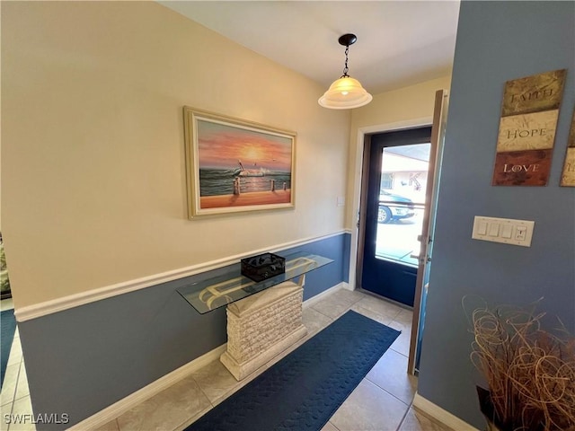 entryway with light tile patterned floors