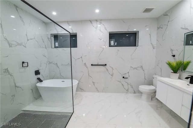 bathroom featuring vanity, toilet, and a bathtub