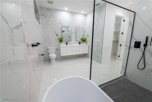 bathroom featuring a bathing tub, vanity, and toilet