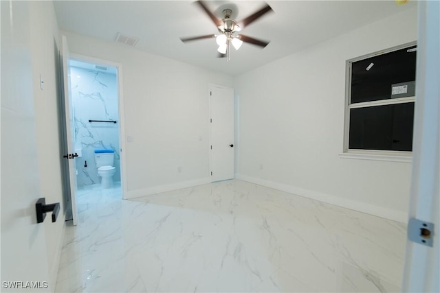 unfurnished room with ceiling fan