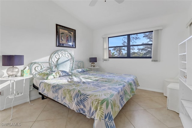 tiled bedroom featuring vaulted ceiling and ceiling fan