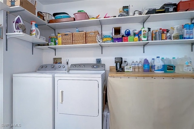 laundry area with washing machine and clothes dryer