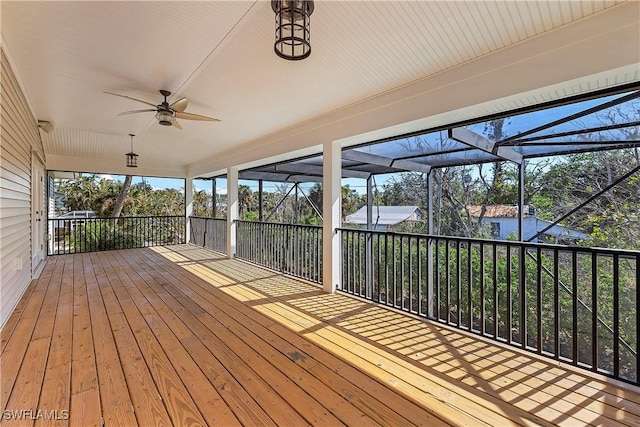 1538 Wilton Ln, Sanibel, FL 33957 - wooden terrace with glass enclosure and ceiling fan