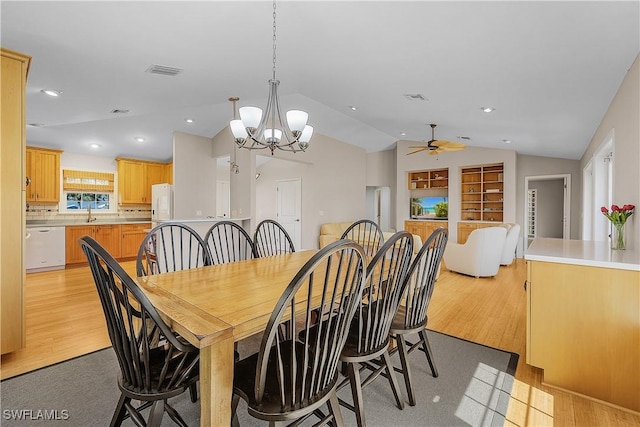 1538 Wilton Ln, Sanibel, FL 33957 - dining area with light wood finished floors, ceiling fan with notable chandelier, visible vents, and lofted ceiling