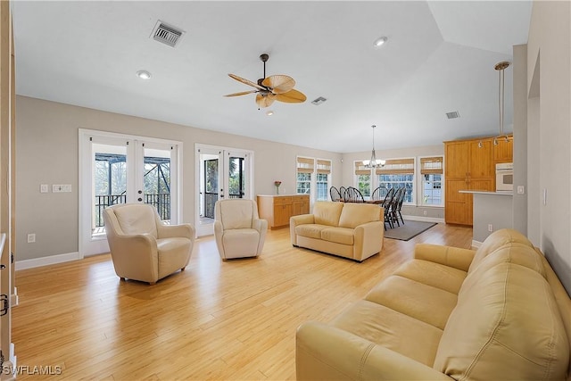 1538 Wilton Ln, Sanibel, FL 33957 - living area with french doors, ceiling fan with notable chandelier, light wood-style floors, and visible vents