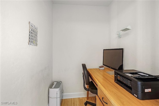 1538 Wilton Ln, Sanibel, FL 33957 - office with baseboards and wood finished floors