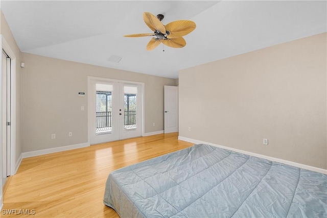 1538 Wilton Ln, Sanibel, FL 33957 - bedroom featuring access to exterior, french doors, a ceiling fan, light wood-type flooring, and baseboards