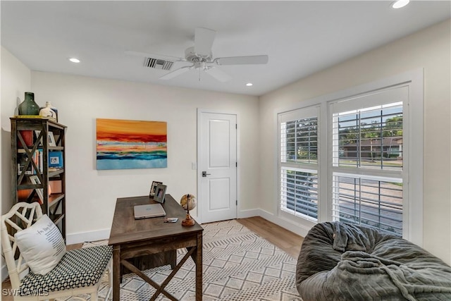 home office featuring ceiling fan and light wood-type flooring