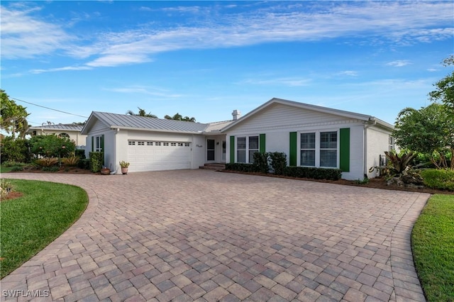 single story home featuring a garage