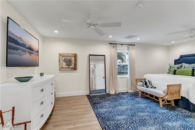 bedroom featuring light hardwood / wood-style floors and ceiling fan