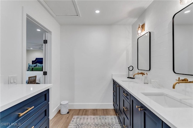 bathroom with hardwood / wood-style flooring and vanity