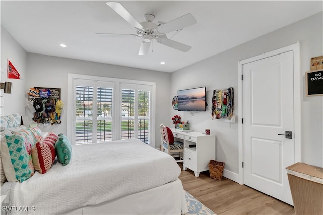 bedroom featuring access to exterior, ceiling fan, and light hardwood / wood-style flooring