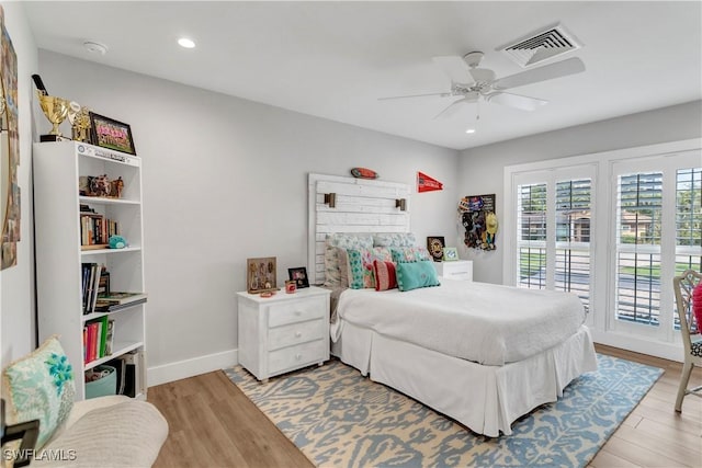 bedroom with access to outside, ceiling fan, and light hardwood / wood-style flooring