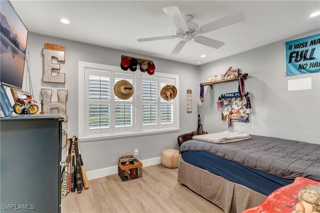 bedroom with ceiling fan and light wood-type flooring