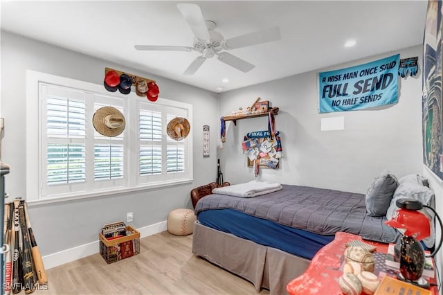 bedroom with ceiling fan and light hardwood / wood-style floors