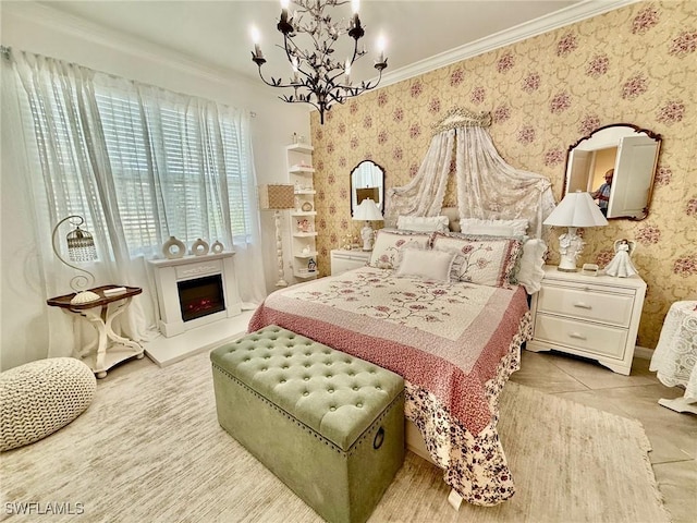 bedroom featuring crown molding and a chandelier