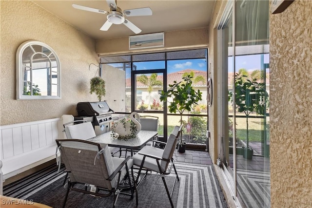 sunroom with ceiling fan and a healthy amount of sunlight