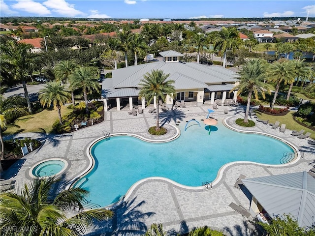 view of pool featuring a patio and a community hot tub