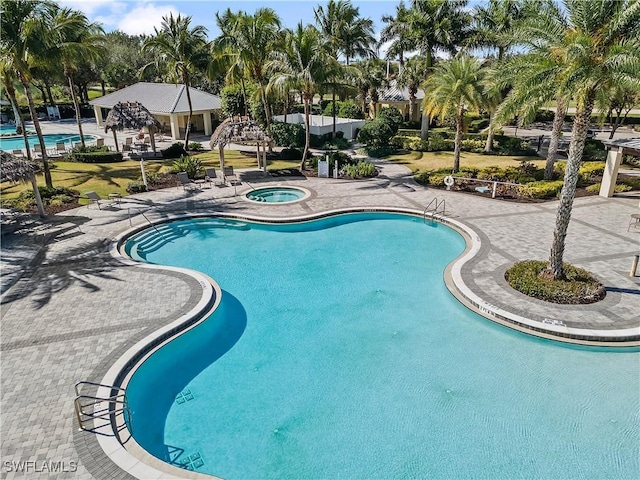 view of pool with a gazebo, a patio area, and a community hot tub