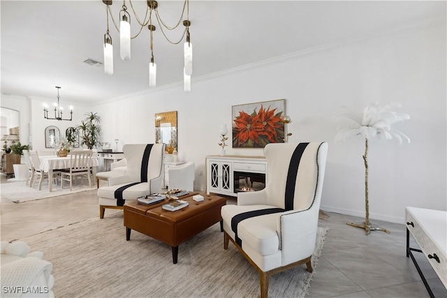 living area featuring ornamental molding and a chandelier