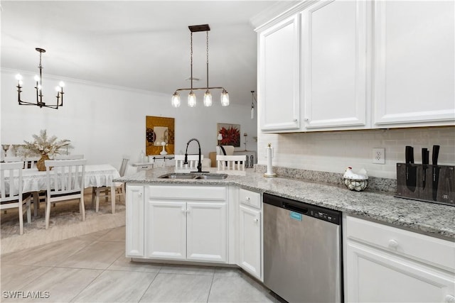 kitchen featuring sink, stainless steel dishwasher, white cabinets, and decorative light fixtures