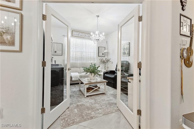 bathroom featuring a chandelier and tile patterned flooring