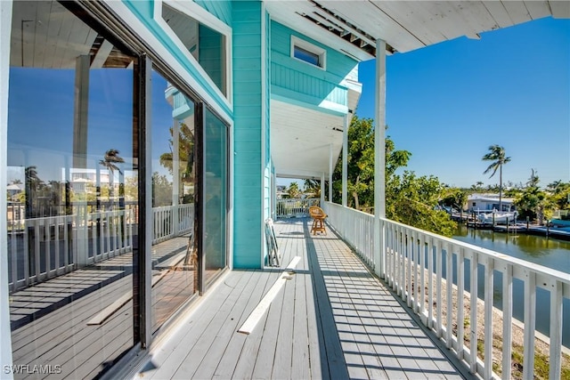 balcony featuring a water view