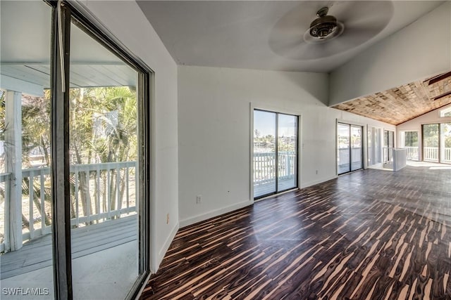 interior space with vaulted ceiling, dark hardwood / wood-style flooring, a wealth of natural light, and ceiling fan