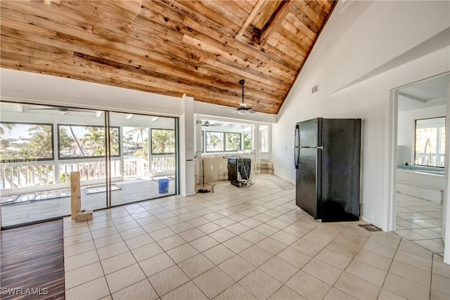 interior space with light tile patterned floors, wood ceiling, high vaulted ceiling, and ceiling fan