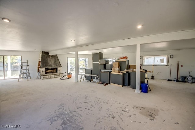 interior space featuring plenty of natural light and a fireplace