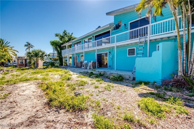 back of property featuring a patio area