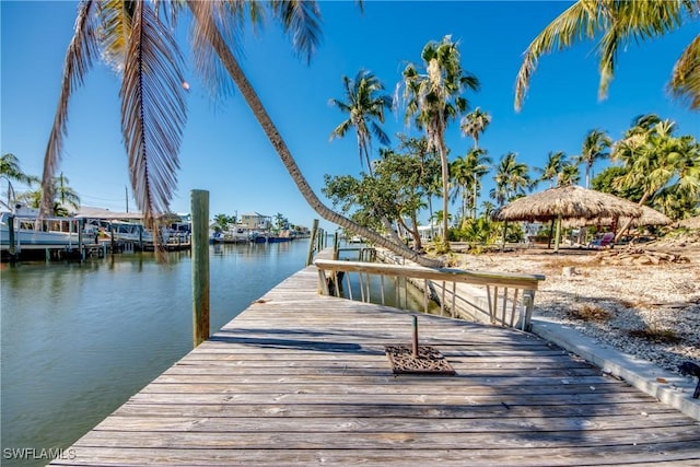 view of dock featuring a water view and a gazebo