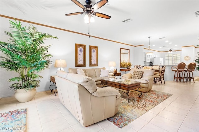 tiled living room featuring crown molding and ceiling fan