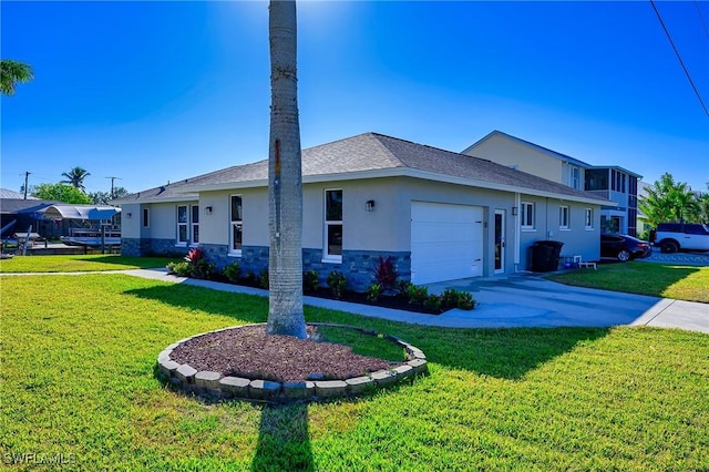 view of side of property with a garage and a lawn