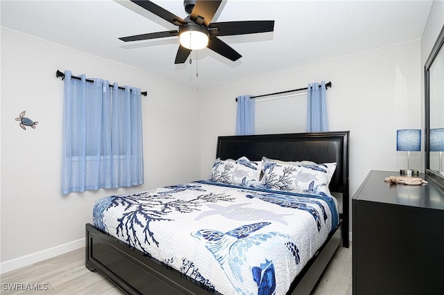 bedroom featuring ceiling fan and light hardwood / wood-style flooring