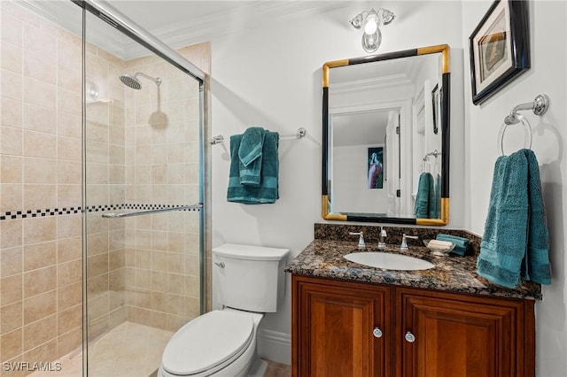 bathroom with ornamental molding, toilet, an enclosed shower, and vanity