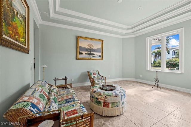 sitting room with crown molding, a tray ceiling, and light tile patterned floors