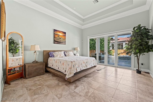 bedroom with french doors, crown molding, access to outside, a tray ceiling, and a high ceiling