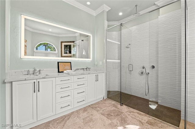 bathroom featuring ornamental molding, a shower with door, and vanity