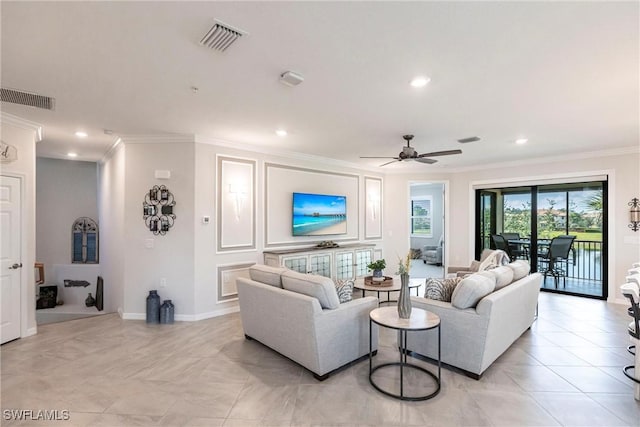 living room with crown molding and ceiling fan