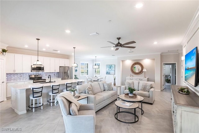 living room with sink, ornamental molding, ceiling fan, and light tile patterned flooring