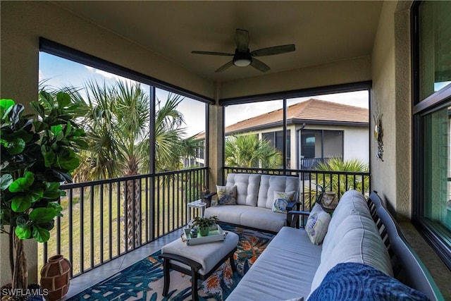 sunroom featuring ceiling fan