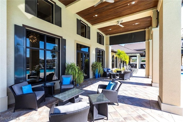 view of patio with outdoor lounge area and ceiling fan