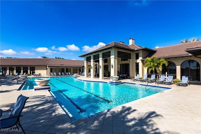 view of swimming pool with a patio