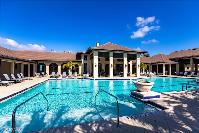 view of swimming pool featuring a patio area