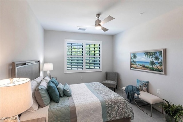 bedroom featuring ceiling fan and carpet