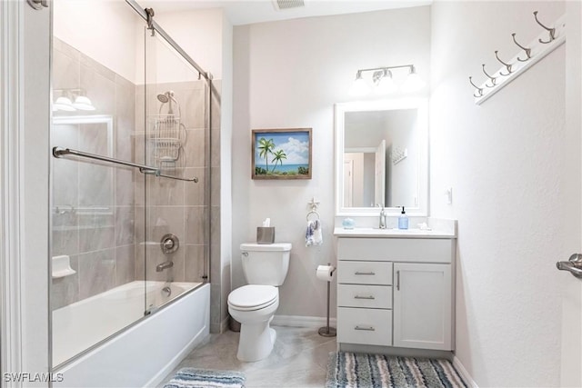 full bathroom featuring toilet, vanity, and shower / bath combination with glass door