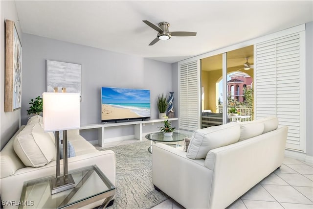 living room featuring light tile patterned flooring and ceiling fan